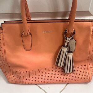 Coach leather Candace perforated tote in peach/tan lining. S/N (A1320-22490).